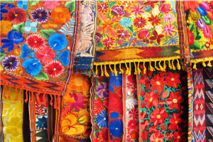 Colorful hand embroidered fabrics in Mexico City Colorful hand embroidered fabrics in Mexico City